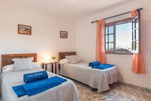 Postel nebo postele na pokoji v ubytování Andres House, Tías