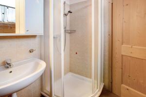 a bathroom with a shower and a sink at Casa Michela Mansarda in Valfurva +15 photos