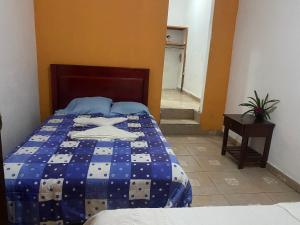 Ένα ή περισσότερα κρεβάτια σε δωμάτιο στο Hotel bulaba