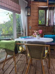 a dining room with a table and chairs at Ferienwohnung-Pension Osterwiese in Weilburg