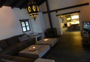 a living room with a couch and a table at Casa Canillas Bo in Canillas de Aceituno