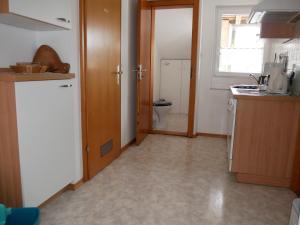 a kitchen with a sink and a toilet in it at Haus Alpenblick in Immenstaad am Bodensee