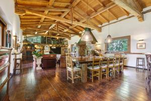 a dining room with a wooden table and chairs at Cà Bossi Retreat above Lake Como in Cernobbio