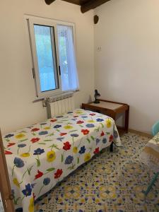 En eller flere senge i et værelse på Appartamenti da Giorgio e Lina