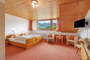 Postel nebo postele na pokoji v ubytování Hotel Eichberg by Ranæla