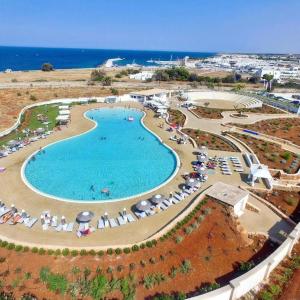 an aerial view of a swimming pool at a resort at Villa Katia - Ostuni in Villanova di Ostuni