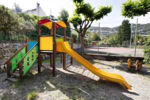 a playground with a slide in a park at Pian Dei Boschi B4104 in Pietra Ligure
