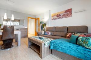 a living room with a couch and a table at Apartamento Martin y Rose en Salou in Salou