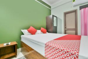 Ένα ή περισσότερα κρεβάτια σε δωμάτιο στο Hotel O Celebration - The Party Point