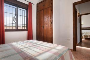 a bedroom with a bed and a large window at Villa Perez Zara 1 in Campano +20 photos