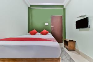 Ένα ή περισσότερα κρεβάτια σε δωμάτιο στο Hotel O Celebration - The Party Point +20 φωτογραφίες