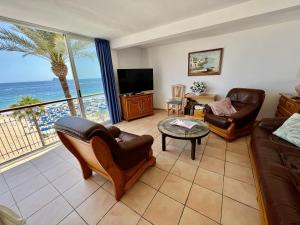 a living room with a view of the ocean at Wg1 Benidorm in Benidorm