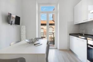 Η κουζίνα ή μικρή κουζίνα στο Viareggio Apartments