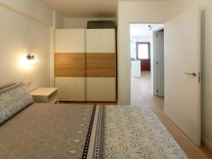 Ένα ή περισσότερα κρεβάτια σε δωμάτιο στο Playa De Las Américas - Oceanfront