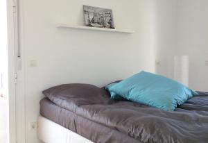 a bed with two pillows on it in a room at Lovely townhouse in Riviera del Sol in Sitio de Calahonda +25 photos