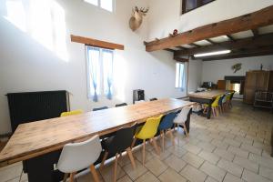 a large room with a large wooden table and chairs at A l oree du bois in Signy-lʼAbbaye +6 photos