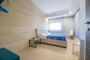 Ένα ή περισσότερα κρεβάτια σε δωμάτιο στο Bianco Mare Otranto