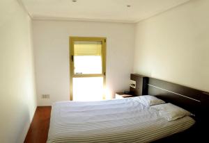 Postel nebo postele na pokoji v ubytování Fabulous Canteras first Beachfront