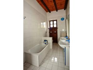 a bathroom with a tub and two sinks at Italian Experience-Villa Incanto in Potenza Picena +15 photos