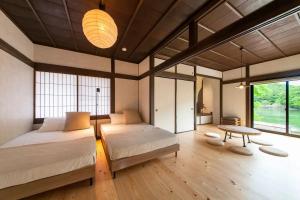 Ένα ή περισσότερα κρεβάτια σε δωμάτιο στο ｇ-gram-