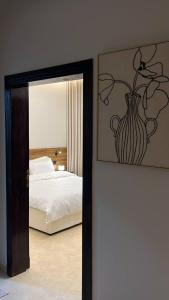 Postel nebo postele na pokoji v ubytování روف