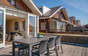 a black table and chairs on a patio at Oostergeest 3 6P in Uitgeest +24 photos