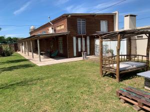 a house with a backyard with a porch and a deck at Don Caffe in San Pedro