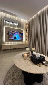 TV a/nebo společenská místnost v ubytování روف