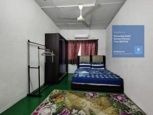 Postel nebo postele na pokoji v ubytování Homestay Bakti