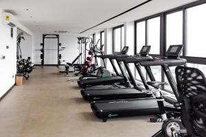 a row of tread machines in a gym at NOVA by BlueWaters Property Management LTD in Accra