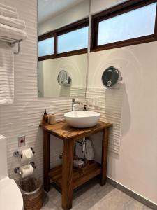 a bathroom with a sink and a mirror at Casa Santiago Hotel Boutique in Querétaro