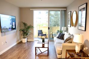 a living room with a couch and a table at Santa Monica Place in Los Angeles