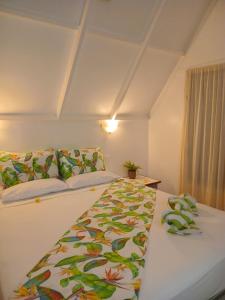 Postel nebo postele na pokoji v ubytování Paradise Cove Lodge