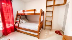 Ένα ή περισσότερα κρεβάτια σε δωμάτιο στο Cabaña Datalu 1