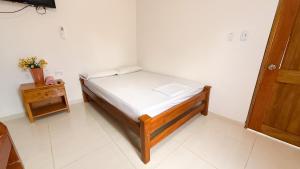 Ένα ή περισσότερα κρεβάτια σε δωμάτιο στο Cabaña Datalu 1 +3 φωτογραφίες