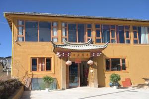 a building with an asian sign on the front of it at The Peak Living in Shangri-La