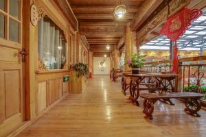 a hallway with benches and tables in a building at The Peak Living in Shangri-La +65 photos