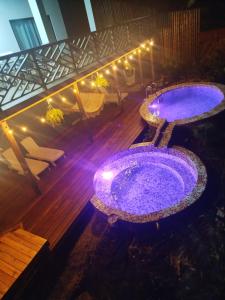 an overhead view of a hot tub on a balcony with lights at La Brisa del Mar in Bastimentos