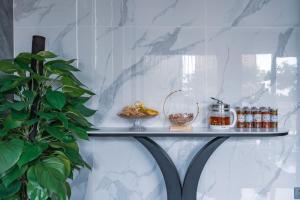 a shelf with food and drinks on a wall at Super 8 Selected Hotel Sanya Bay Coconut Dream Corridor in Sanya