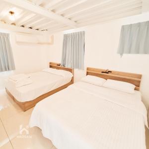 Postel nebo postele na pokoji v ubytování 埔里福興宣安獨棟民宿