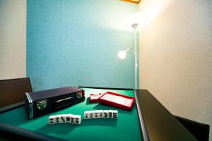 a room with a table with dice and a lamp at Sumoto - House - Vacation STAY 83638v in Sumoto