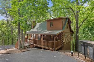a cabin in the middle of the woods at Cozy cabin, Bed swing, Arcade game, hot tub in Sevierville