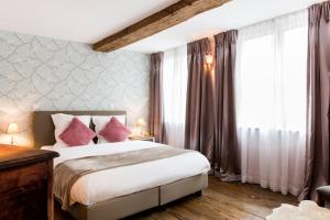 Postel nebo postele na pokoji v ubytování BnB City