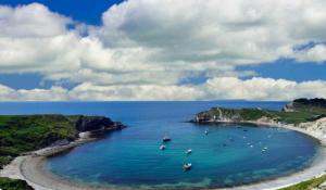 a group of boats in a large body of water at E67 DURDLE DOOR Ref 11663 in Wareham +17 photos
