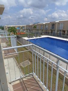 a view of a swimming pool at a apartment complex at Casa ubicada en zona campestre de Ibagué in Ibagué