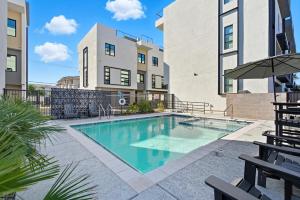 a swimming pool in the middle of a building at Papago Townhouse-Rooftop Deck-Old Town in Scottsdale