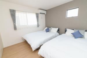 Ένα ή περισσότερα κρεβάτια σε δωμάτιο στο Burikina Terrace N