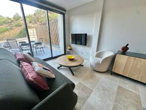 a living room with a couch and a table at Collioure - Charmant logement pour 2 personnes - FR-1-309-544 in Port-Vendres