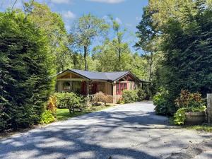 a house on a street with a driveway at 826 Wilson Road in Highlands