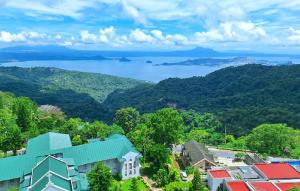 an aerial view of a town with mountains and water at SweetLove Hideaway CITYLAND Condo 2-BR, 2-Bath, Living room, Sleeps 12, Kitchen, Free Pool, Wi-Fi, 2 Parking, View-Deck on 24F rooftop in Iruhin